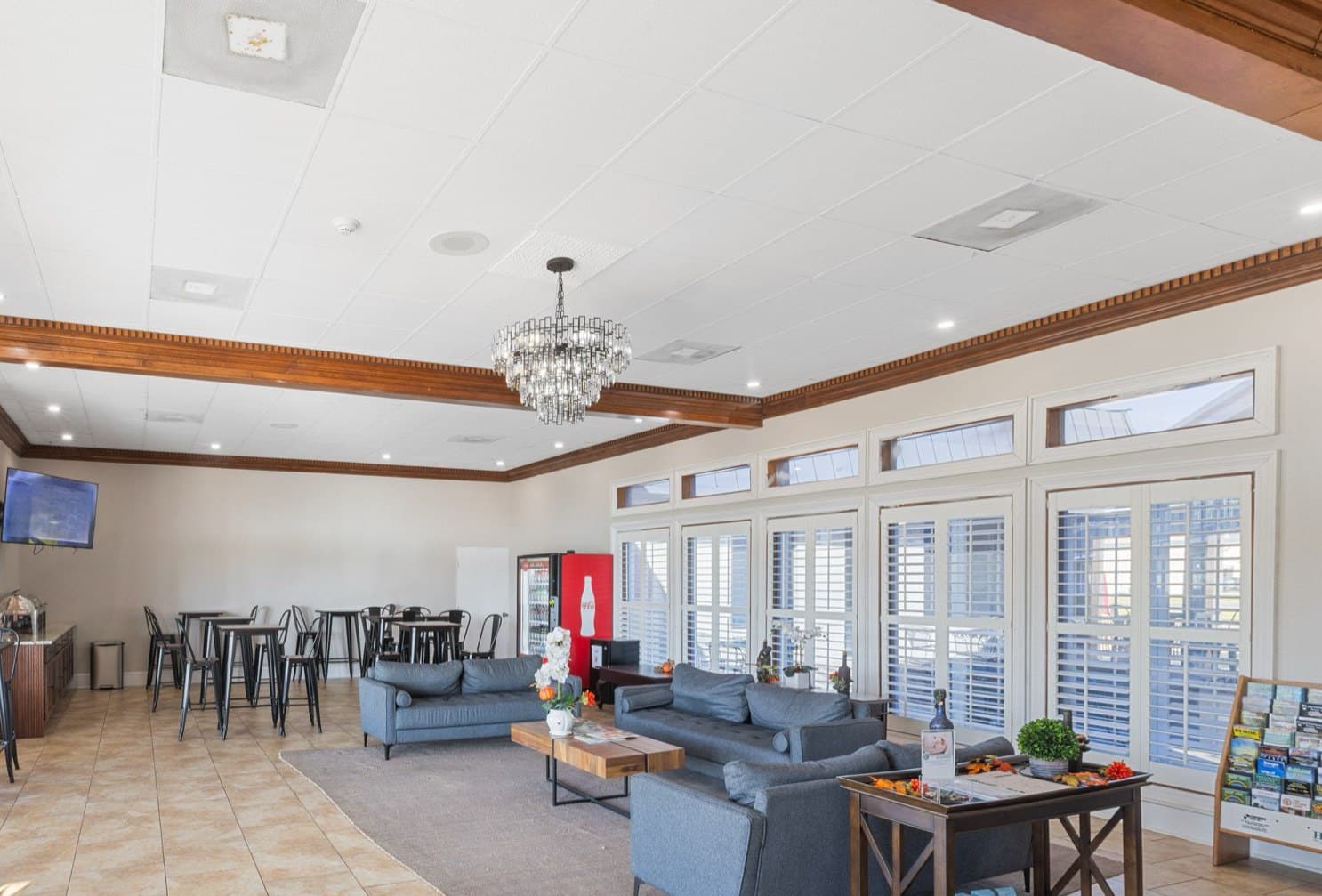 The lobby lounge with sofas, breakfast tables and a chandelier